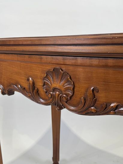 Molded and carved wood game table opening...