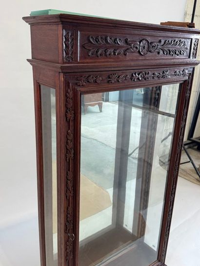 Moulded, carved and stained oak display case...