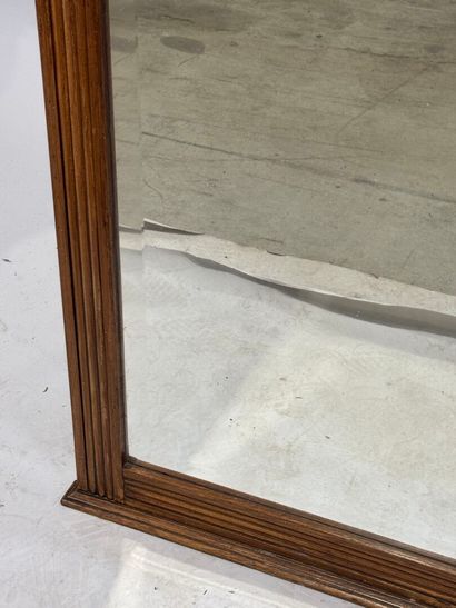 Molded and carved wood mirror with a frieze...