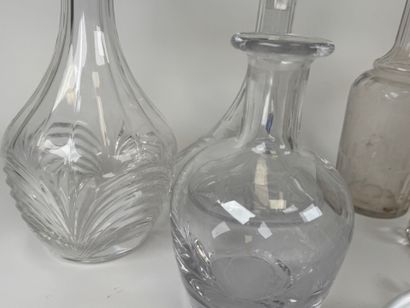 Seven glass and crystal decanters.
H. 30...
