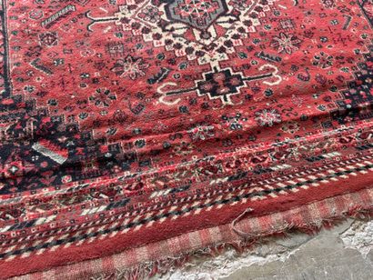 Polychrome wool carpet with stylized motifs...
