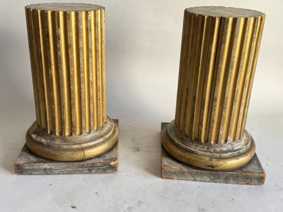 Pair of patinated and gilded oak sellettes...