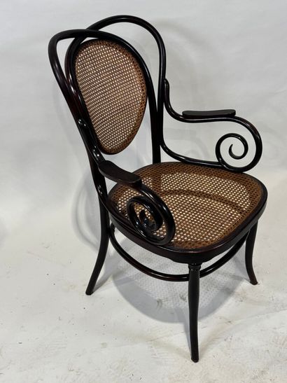 KOHN Stained bentwood armchair, cane seat....