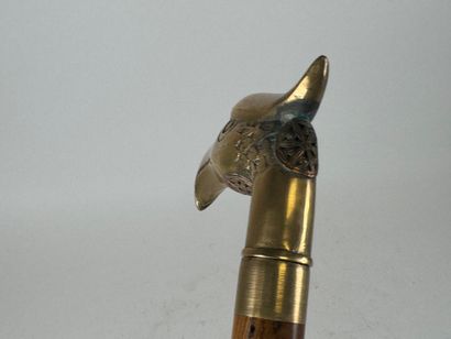 Wooden and brass system cane, the pommel...