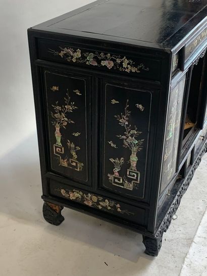 ASIA, 20th C. Low cabinet opening with two...