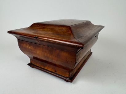 Wood and veneer chest in the shape of a sarcophagus.
Restoration...