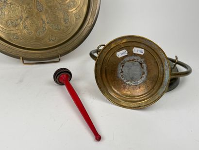 Chased brass gong with painted wooden hammer....