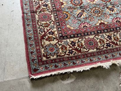 Polychrome wool carpet with floral motifs....