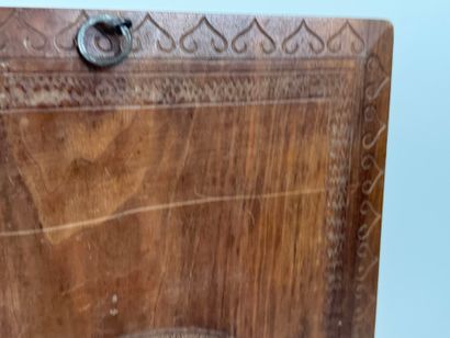 A two-plate folio in carved wood with the...