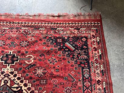 Polychrome wool carpet with stylized motifs...