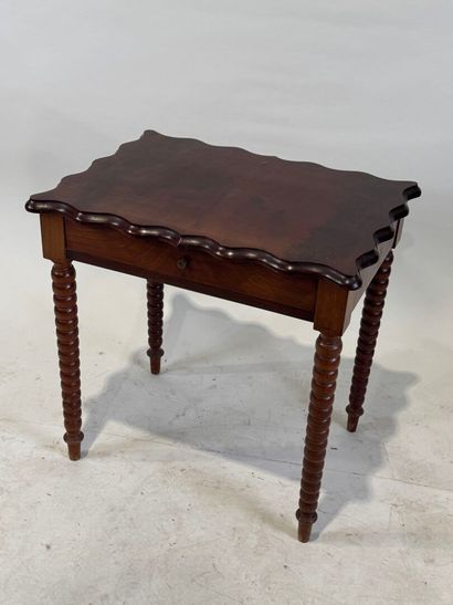 Small stained wood table or desk opening...