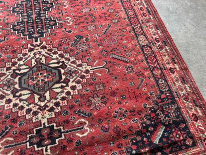Polychrome wool carpet with stylized motifs...