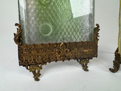 Two beveled glass and openwork brass photo...