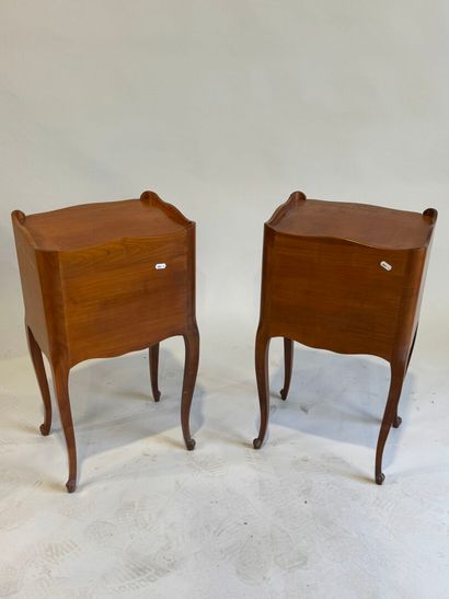 Pair of molded cherrywood bedside tables...
