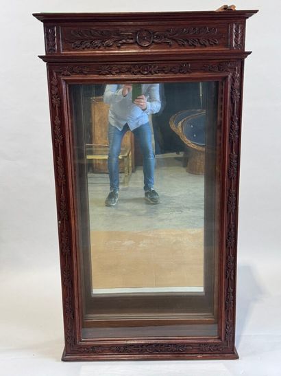 Moulded, carved and stained oak display case...