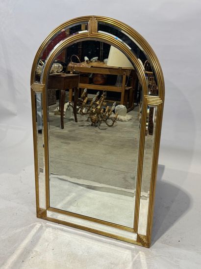Gilded wood mirror with rounded top and beveled...
