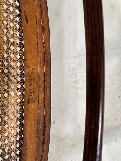 KOHN Stained bentwood armchair, cane seat....