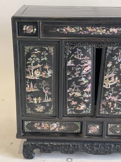 ASIA, 20th C. Low cabinet opening with two...