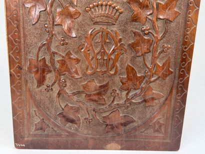 A two-plate folio in carved wood with the...