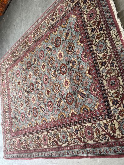 Polychrome wool carpet with floral motifs....