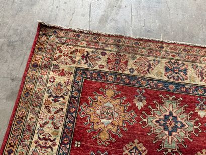 KAZAK. 
Polychrome wool carpet, the central...