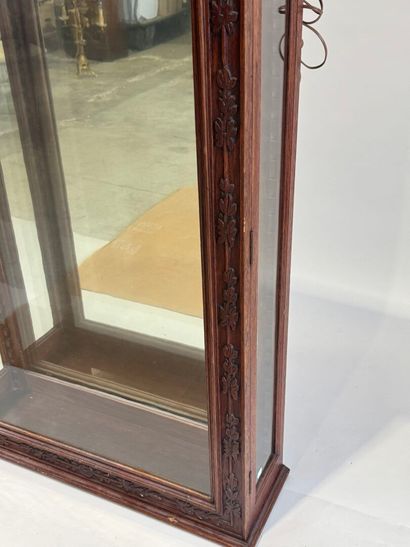 Moulded, carved and stained oak display case...