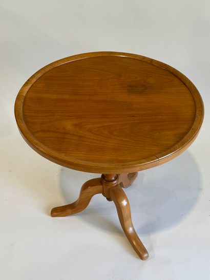 Small circular tripod pedestal table in fruitwood....