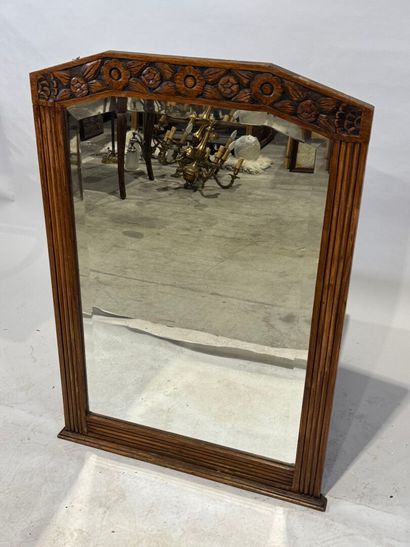 Molded and carved wood mirror with a frieze...