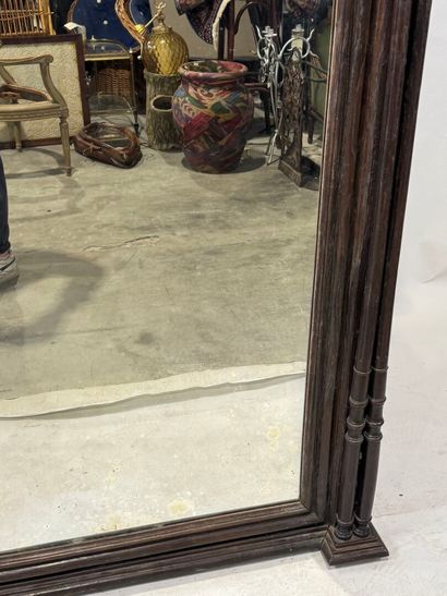 Large mirror in stained wood, the uprights...