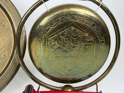 Chased brass gong with painted wooden hammer....