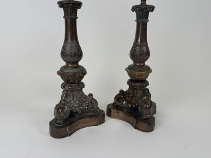 Pair of tripod candlesticks in patinated...
