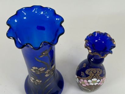 Two colored glass vases, one enameled with...