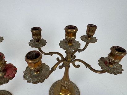 Two pairs of brass torches or candlesticks,...