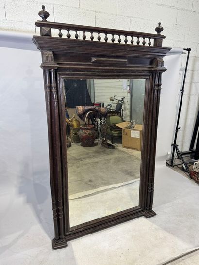 Large mirror in stained wood, the uprights...