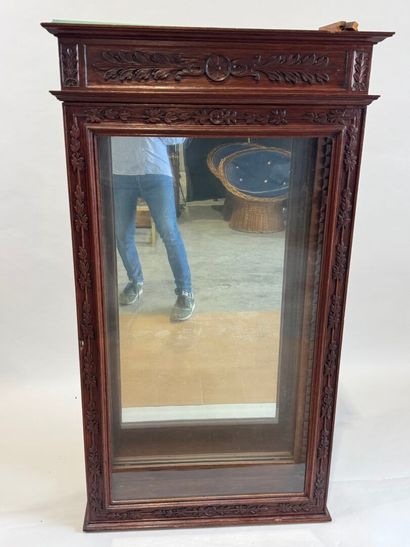 Moulded, carved and stained oak display case...