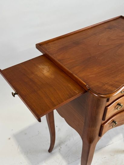 Moulded wood bedside table opening with three...