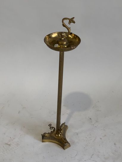 Brass ashtray decorated with stylized dolphins.
H....