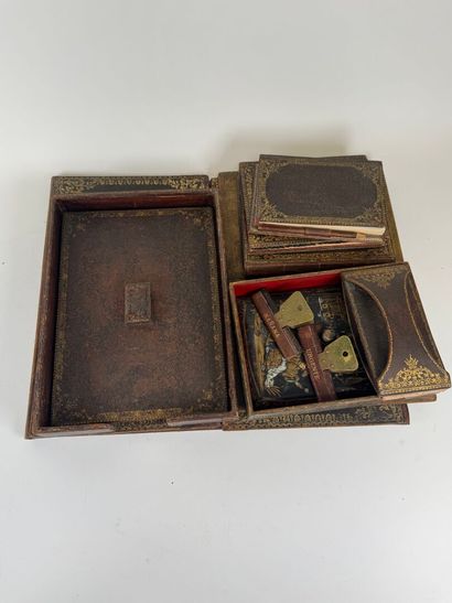 Leather desk set with gold embossed foliate...