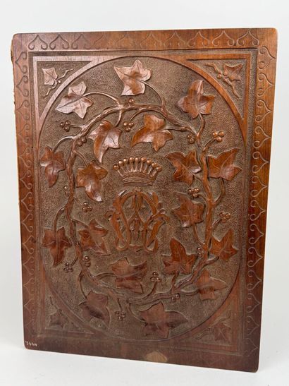 A two-plate folio in carved wood with the...