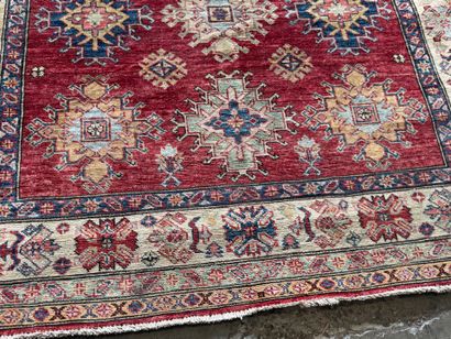 KAZAK. 
Polychrome wool carpet, the central...