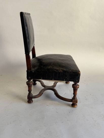 Small low chair in molded wood, black leather...