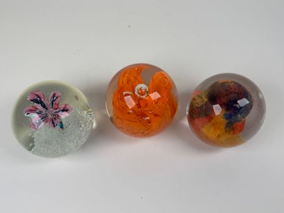 Three sulfur balls or paperweights in colored...