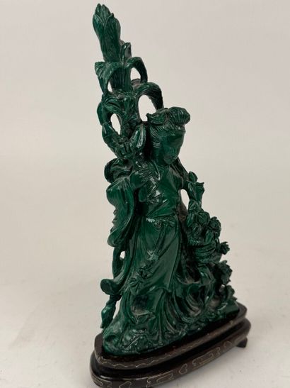 CHINA, 20th century.
Woman with flowers.
Carved...