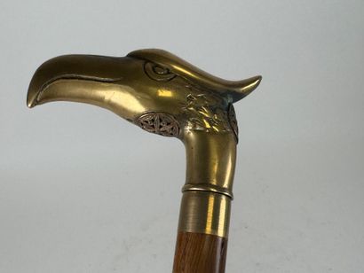 Wooden and brass system cane, the pommel...
