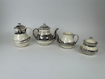 LANGEAIS.
Four cream and silvered earthenware...