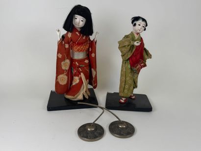 ASIA, 20th century.
Two figures in traditional...