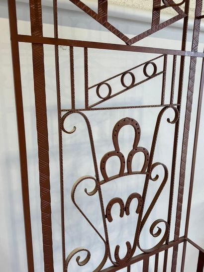 Wrought and painted iron checkroom decorated...
