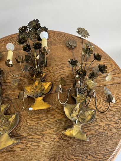 Suite of three four-light gilded metal sconces...