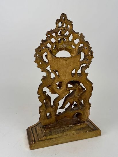 Carved and gilded wood and stucco watch-holder...