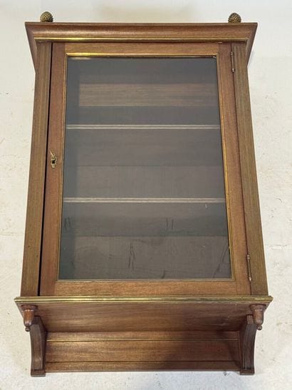 Wall-mounted display case in molded wood...